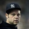 NEW YORK - APRIL 21: Joba Chamberlain #62 of the New York Yankees watches on from the dugout against the Oakland Athletics on April 21, 2009 at Yankee Stadium in the Bronx borough of New York City.  (Photo by Nick Laham/Getty Images)