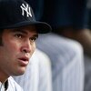 NEW YORK - JUNE 30:  Left fielder Johnny Damon #18 of the New York Yankees sits in the dugout before the game against the Seattle Mariners June 30, 2009 at Yankee Stadium in the Bronx borough of New York City.  (Photo by Mario Tama/Getty Images)