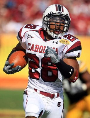 TAMPA, FL - JANUARY 01:  Eric Baker #28 of the South Carolina Gamecocks runs upfield against the Iowa Hawkeyes during the Outback Bowl on January 1, 2009 at Raymond James Stadium in Tampa, Florida.  (Photo by Scott Halleran/Getty Images)