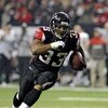 ATLANTA - DECEMBER 14: Running back Michael Turner #33 of the Atlanta Falcons rushes upfield against the Tampa Bay Buccaneers  at the Georgia Dome on December 14, 2008 in Atlanta, Georgia.  (Photo by Al Messerschmidt/Getty Images) 