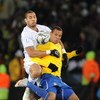 JOHANNESBURG, SOUTH AFRICA - JUNE 28: Oguchi Onyewu and Luis Fabiano compete during the 2009 Confederations Cup final match between Brazil and USA from Ellis Park on June 28, 2009 in Johannesburg, South Africa. (Photo by Lefty Shivambu/Gallo Images/Getty 