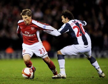 WEST BROMWICH, UNITED KINGDOM - MARCH 03:  Andrey Arshavin (L) of Arsenal holds off a challenge from Filipe Teixeira of West Bromwich Albion during the Barclays Premier League match between West Bromich Albion and Arsenal at The Hawthorns on March 3, 2009
