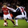 WEST BROMWICH, UNITED KINGDOM - MARCH 03:  Andrey Arshavin (L) of Arsenal holds off a challenge from Filipe Teixeira of West Bromwich Albion during the Barclays Premier League match between West Bromich Albion and Arsenal at The Hawthorns on March 3, 2009