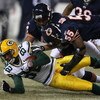 CHICAGO - DECEMBER 22: Lance Briggs #55 and Kevin Payne #44 of the Chicago Bears bring down Ruvell Martin #82 of the Green Bay Packers on December 22, 2008 at Soldier Field in Chicago, Illinois.  The Bears defeated the Packers 20-17 in overtime. (Photo by