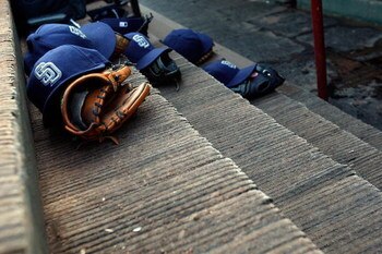 ARLINGTON, TX - JUNE 28:  Hats and gloves of the San Diego Padres on June 28, 2009 at Rangers Ballpark in Arlington, Texas.  (Photo by Ronald Martinez/Getty Images)