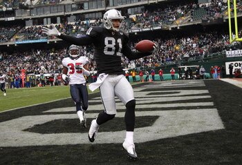 OAKLAND, CA - DECEMBER 21: Chaz Schilens #81 of the Oakland Raiders celebrates scoring a touchdown past Jacques Reeves #35 of the Houston Texans during an NFL game on December 21, 2008 at the Oakland-Alameda County Coliseum in Oakland, California. (Photo