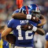 EAST RUTHERFORD, NJ - NOVEMBER 02:  Steve Smith #12 of the New York Giants meets Brandon Jacobs #27 after scoring a touchdown against the Dallas Cowboys during their game on November 2, 2008 at Giants Stadium in East Rutherford, New Jersey.  (Photo by Al 