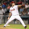 PHOENIX - APRIL 22:  Starting pitcher Dan Haren #15 of the Arizona Diamondbacks pitches against the Colorado Rockies during the game at Chase Field on April 22, 2009 in Phoenix, Arizona. The Diamondbacks defeated the Rockies 2-0.  (Photo by Christian Pete