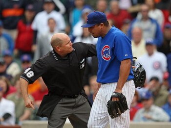 CHICAGO - MAY 27: Home plate umpire Mark Carlson #48 ejects starting pitcher Carlos Zambrano #38 of the Chicago Cubs after an arguement over a play at the plate between Zambrano and Nyjer Morgan of the Pittsburgh Pirates on May 27, 2009 at Wrigley Field i