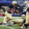 BALTIMORE - NOVEMBER 15:  Ricky Dobbs #4 of the Navy Midshipmen runs the ball against the Notre Dame Fighting Irish on November 15, 2008 at M&T Bank Stadium in Baltimore, Maryland. Notre Dame defeated Navy 27-21.  (Photo by Jim McIsaac/Getty Images)