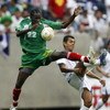 HOUSTON - JUNE 17: Loic Loval #22 of Guadeloupe goes for this ball against Amado Guevara #20 of Honduras during their quarterfinal match of the CONCACAF Gold Cup 2007 tournament at Reliant Stadium June 17, 2007 in Houston, Texas. Guadeloupe defeated Hondu