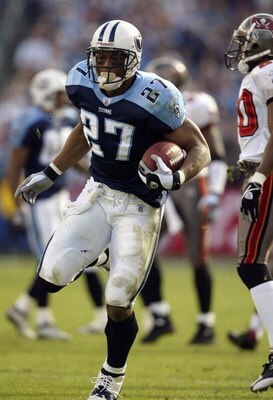 NASHVILLE, TN - DECEMBER 28:  Running back Eddie George #27 of the Tennessee Titans runs the football during the game against the Tampa Bay Buccaneers on December 28, 2003 at The Coliseum in Nashville, Tennessee. The Titans defeated the Buccaneers 33-13. 