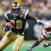 ST. LOUIS - NOVEMBER 7:   Running back Marshall Faulk #28 of the St. Louis Rams runs upfield against the New England Patriots on November 7, 2004 at the Edward Jones Dome in St. Louis, Missouri. The Patriots defeated the Rams 40-22. (Photo by Elsa/Getty I