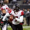 PHILADELPHIA - DECEMBER 31:  Michael Vick #7 of the Atlanta Falcons looks to pass against the Philadelphia Eagles in NFL action December 31, 2006 at Lincoln Financial Field in Philadelphia, Pennsylvania. The Eagles won 24-17.  (Photo by Jim McIsaac/Getty 