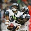 CHICAGO - JANUARY 14:  Running back Shaun Alexander #37 and wide receiver Deion Branch #83 of the Seattle Seahawks celebrate a play against the Chicago Bears during their NFC Divisional Playoff game on January 14, 2007 at Soldier Field in Chicago, Illinoi