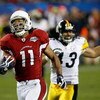 TAMPA, FL - FEBRUARY 01:  Wide receiver Larry Fitzgerald #11 of the Arizona Cardinals scores a 64-yard touchdown reception in the fourth quarter against Troy Polamalu #43 of the Pittsburgh Steelers during Super Bowl XLIII on February 1, 2009 at Raymond Ja