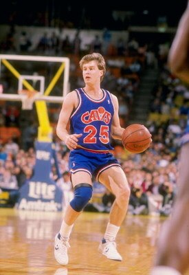 Guard Mark Price of the Cleveland Cavaliers moves the ball during a game.