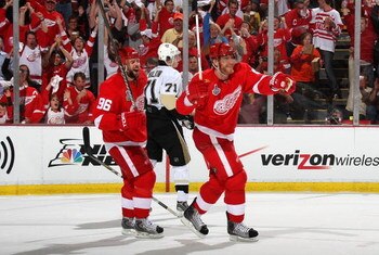 DETROIT - MAY 30:  Tomas Holmstrom #96 and Marian Hossa #81 of the Detroit Red Wings celebrate after Hossa's goal against the Pittsburgh Penguins during Game 1 of the 2009 Stanley Cup Finals at Joe Louis Arena on May 30, 2009 in Detroit, Michigan.  (Photo