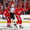 DETROIT - MAY 30:  Tomas Holmstrom #96 and Marian Hossa #81 of the Detroit Red Wings celebrate after Hossa's goal against the Pittsburgh Penguins during Game 1 of the 2009 Stanley Cup Finals at Joe Louis Arena on May 30, 2009 in Detroit, Michigan.  (Photo