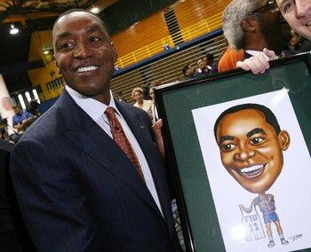 MIAMI - APRIL 15:  Isiah Thomas is presented with artwork by Fernando Ottati after he was introduced as the new head coach for Florida International Univeristy men's basketball team at U.S.Century Bank Arena on April 15, 2009 in Miami, Florida.  (Photo by