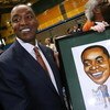 MIAMI - APRIL 15:  Isiah Thomas is presented with artwork by Fernando Ottati after he was introduced as the new head coach for Florida International Univeristy men's basketball team at U.S.Century Bank Arena on April 15, 2009 in Miami, Florida.  (Photo by