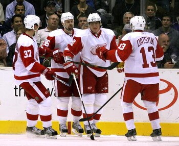 LOS ANGELES, CA - OCTOBER 27:  Marian Hossa #81 of the Detroit Red Wings celebrates with teammates Mikael Samuelsson #37, Tomas Holmstrom #96 and Pavel Datsyuk #13 after Hossa scored a second period power play goal against the Los Angeles Kings during the