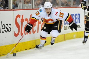 PITTSBURGH - MARCH 25: Forward Mike Cammalleri #13 of the Calgary Flames skates with the puck against the Pittsburgh Penguins on March 25, 2009 at Mellon Arena in Pittsburgh, Pennsylvania.  (Photo by Jamie Sabau/Getty Images)