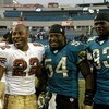 San Francisco 49ers  fullback Terry Jackson (22) greets Jacksonville Jaguars Mike Peterson (54) and defensive  end Bobby McCray (93)  December 18, 2005 in Jacksonville.   The three players are University of Florida graduates.   The Jaguars defeated the 49