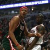 CHICAGO - MARCH 06:  Charlie Villanueva #31 of the Milwaukee Bucks reacts after he didn't get a call on an offensive play which he thought he was fouled on in the first quarter as Ben Gordon #7 of the Chicago Bulls looks on at the United Center on March 6