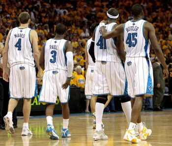 NEW ORLEANS - APRIL 25: (L-R) Sean Marks #4, Chris Paul #4,James Posey #41 and Rasual Butler #45 of the New Orleans Hornets walk across the court during Game Three of the Western Conference Quarterfinals against the Denver Nuggets during the 2009 NBA Pla