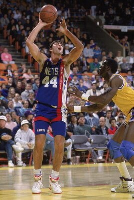 LOS ANGELES - 1990:  Jack Haley #44 of the New Jersey Nets shoots the ball over Orlando Woolridge #0 of the Los Angeles Lakers during the NBA game at the Great Western Forum in Los Angeles, California in 1990. NOTE TO USER: User expressly acknowledges and