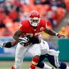 KANSAS CITY, MO - DECEMBER 14:  Larry Johnson #27 of the Kansas City Chiefs tries to break a tackle against the San Diego Chargers during the first half on December 14, 2008 at Arrowhead Stadium in Kansas City, Missouri. The Chiefs lost 22-21.  (Photo by 