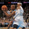 DENVER - APRIL 29:   David West #30 of the New Orleans Hornets drives against  Carmelo Anthony # 15 of the Denver Nuggets in Game Five of the Western Conference Quarterfinals during the 2009 NBA Playoffs at Pepsi Center on April 29, 2009 in Denver, Colora