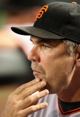PHOENIX - JUNE 11:  Manager Bruce Bochy of the San Francisco Giants signals a play during the major league baseball game against the Arizona Diamondbacks at Chase Field on June 11, 2009 in Phoenix, Arizona.  (Photo by Christian Petersen/Getty Images)
