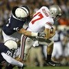 UNIVERSITY PARK, PA - OCTOBER 27: Quarterback Todd Boeckman #17 of the Ohio State Buckeyes is tackled by linebacker Sean Lee #45 of the Penn State Nittany Lions during a game at Beaver Stadium on October 27, 2007 in University Park, Pennsylvania. Ohio Sta