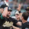 OAKLAND, CA - JUNE 23: Jason Giambi #16 of the Oakland Athletics is congratulated after hitting a home run against the San Francisco Giants during a Major League Baseball game on June 23, 2009 at the Oakland Coliseum in Oakland, California. (Photo by Jed 