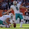 DENVER - NOVEMBER 02:  Place kicker Dan Carpenter #5 of the Miami Dolphins kicks a 45 yard field goal from the hold of Brandon Fields in the first quarter against the Denver Broncos during NFL action at Invesco Field at Mile High on November 2, 2008 in De