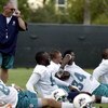 DAVIE, FL - JUNE 06:  Head coach Tony Sparano (L) watches running back Ricky Williams #34 stretch during Miami Dolphins Mini Camp on June 6, 2008 at the Dolphins practice facility in Davie, Florida.  (Photo by Marc Serota/Getty Images)
