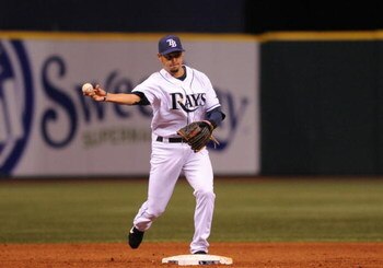 ST. PETERSBURG, FL - APRIL 13: Shortstop Jason Bartlett #8 of the of the the Tampa Bay Rays throws to first base against the New York Yankees April 13, 2009 in St. Petersburg, Florida.  (Photo by Al Messerschmidt/Getty Images)