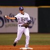 ST. PETERSBURG, FL - APRIL 13: Shortstop Jason Bartlett #8 of the of the the Tampa Bay Rays throws to first base against the New York Yankees April 13, 2009 in St. Petersburg, Florida.  (Photo by Al Messerschmidt/Getty Images)