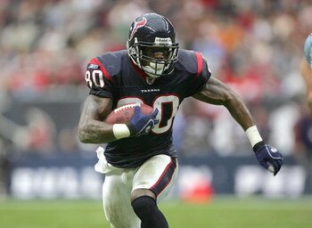 HOUSTON - DECEMBER 10: Andre Johnson #80of the Houston Texans carries the ball during the game against the Tennessee Titans on December 10, 2006 at Reliant Stadium in Houston, Texas. The Titans won 26-20 in overtime. (Photo by Stephen Dunn/Getty Images)