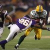 MINNEAPOLIS - NOVEMBER 09:  Running back Ryan Grant #25 of the Green Bay Packers carries the ball against cornerback Antoine Winfield #26 of the Minnesota Vikings on November 9, 2008 at the Metrodome in Mineapolis, Minnesota.  The Vikings won 28-27.  (Pho
