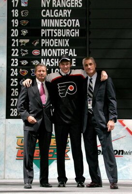 COLUMBUS, OH - JUNE 22:  Second overall pick James vanRiemsdyk of the Philadelphia Flyers poses with team General Manager Paul Holmgren,right, along with another member of team personnel onstage after being drafted in the first round of the 2007 NHL Entry