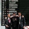 COLUMBUS, OH - JUNE 22:  Second overall pick James vanRiemsdyk of the Philadelphia Flyers poses with team General Manager Paul Holmgren,right, along with another member of team personnel onstage after being drafted in the first round of the 2007 NHL Entry
