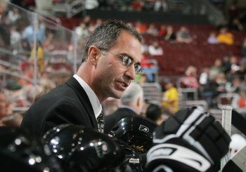 PHILADELPHIA - SEPTEMBER 22: Head coach John Stevens of the Philadelphia Flyers speaks to his team during the game against the New Jersey Devils on September 22, 2008 at the Wachovia Center in Philadelphia, Pennsylvania. The Flyers defeated the Devils 4-1