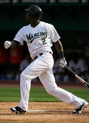 MIAMI - APRIL 06:  Hanley Ramirez #2 of the Florida Marlins drives in Emilio Bonifacio #1 with a double in the third inning against the Washington Nationals on opening day at Dolphin Stadium on April 6, 2009 in Miami, Florida.  (Photo by Doug Benc/Getty I