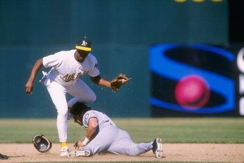 26 Sep 1996:   Infielder Alex Diaz of the Oakland A's puts a tag on runner Tony Batista of the Seattle Mariners during the A's 7-5 victory over the Mariners at Oakland Coliseum in Oakland, California. Mandatory Credit: Otto Greule Jr.  /Allsport
