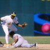 26 Sep 1996:   Infielder Alex Diaz of the Oakland A's puts a tag on runner Tony Batista of the Seattle Mariners during the A's 7-5 victory over the Mariners at Oakland Coliseum in Oakland, California. Mandatory Credit: Otto Greule Jr.  /Allsport