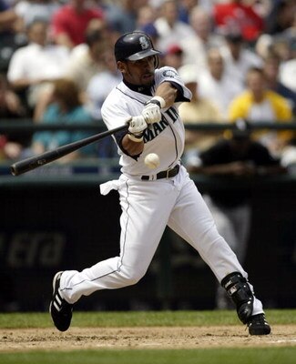 SEATTLE - JUNE 5:  Hiram Bocachica #44 of the Seattle Mariners hits an infield single in his first at bat against the Chicago White Sox on June 5, 2004 at Safeco Field in Seattle, Washington.  (Photo by Otto Greule Jr/Getty Images)