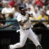 SEATTLE - JUNE 5:  Hiram Bocachica #44 of the Seattle Mariners hits an infield single in his first at bat against the Chicago White Sox on June 5, 2004 at Safeco Field in Seattle, Washington.  (Photo by Otto Greule Jr/Getty Images)